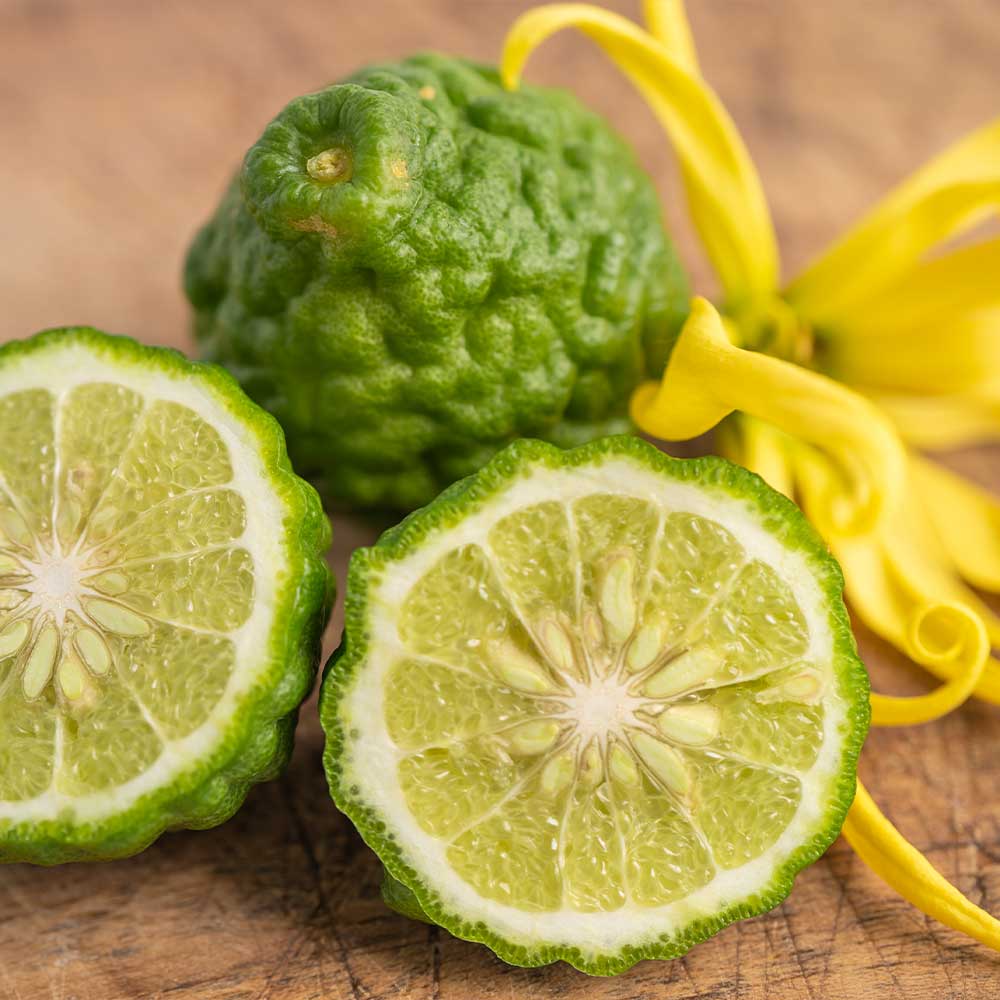 Green fruit with yellow flowers on a wooden surface